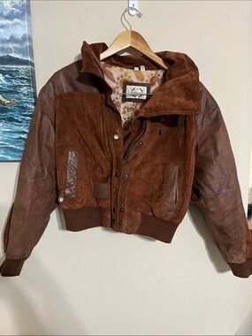 vintage 1980s Paris Sport Club bomber-style leather jacket.